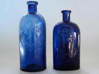USA Hosp Dept cobalt blue oval and round bottles